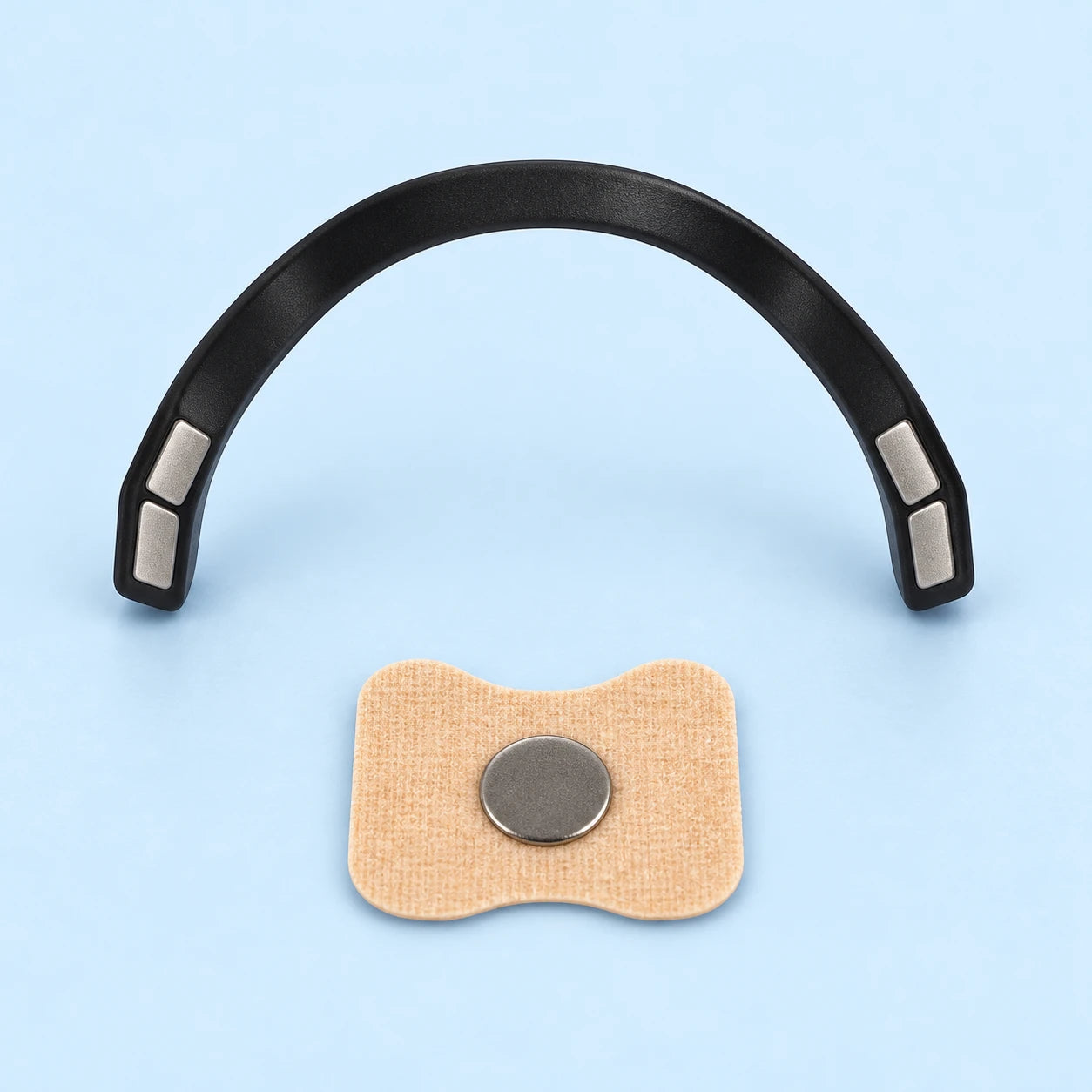 Close-up of magnetic nasal band and adhesive tab